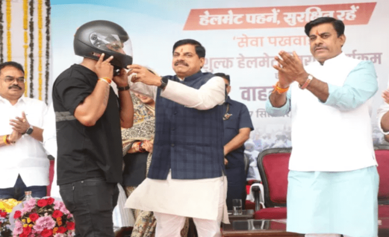 Mohan Yadav CM distributing helmets